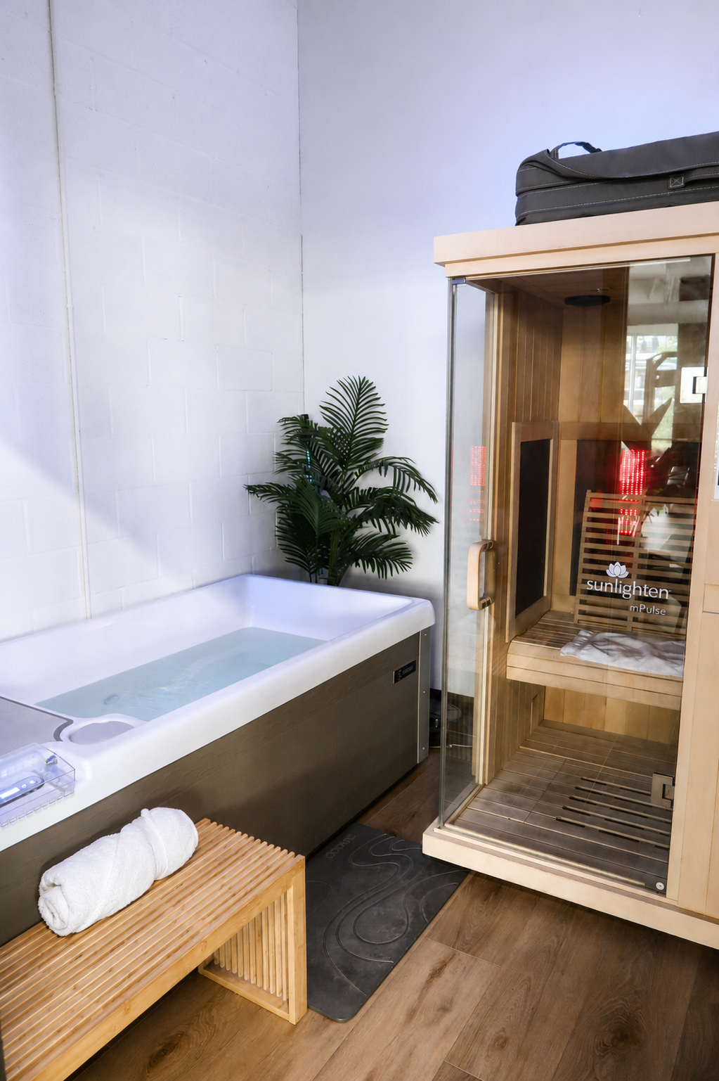 Cold plunge and infrared sauna in the recovery suite at Revision Fitness & Wellness.